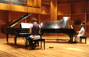 Etsuko and John playing Piano 44 Hands.